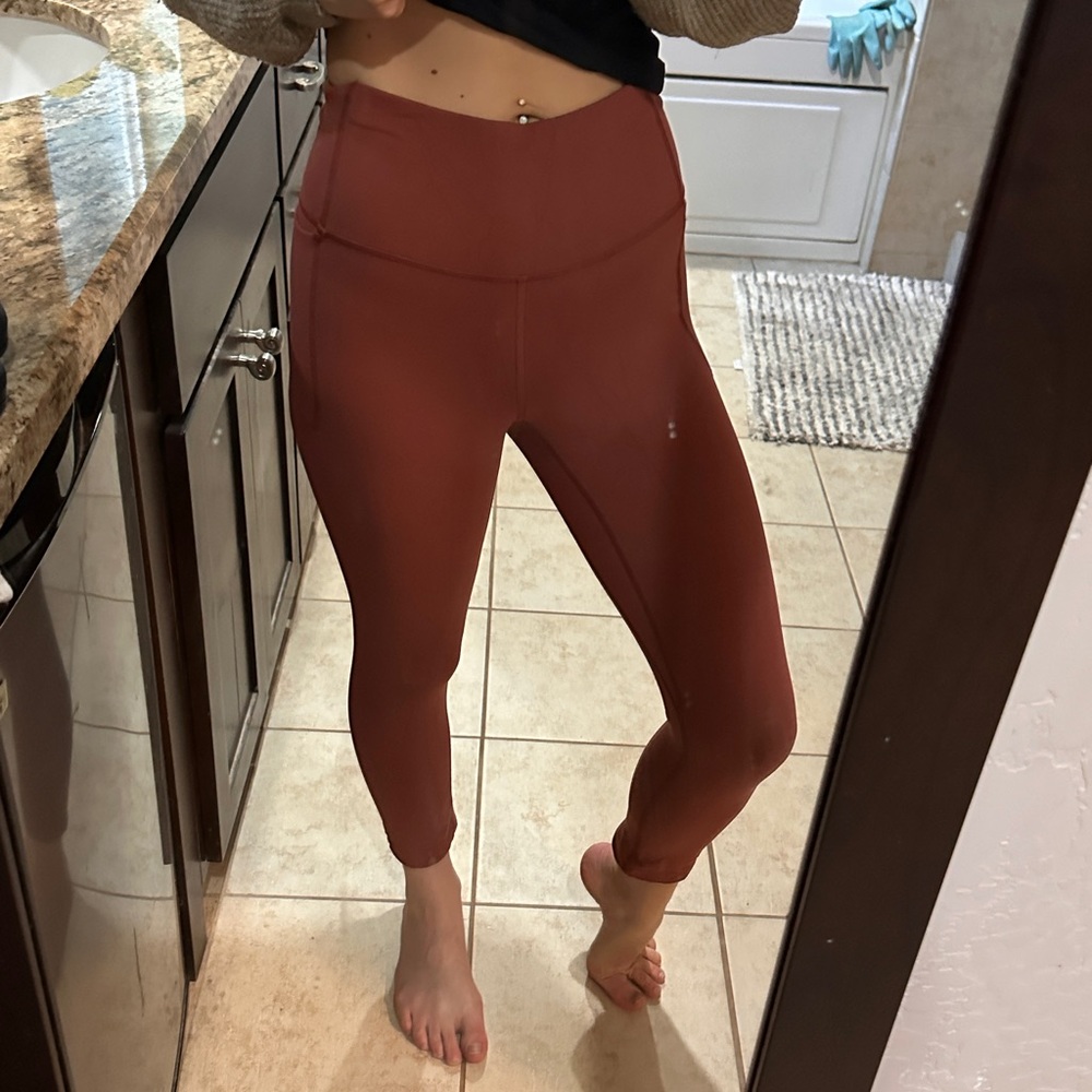 Under Armour Maroon Leggings with pockets.
